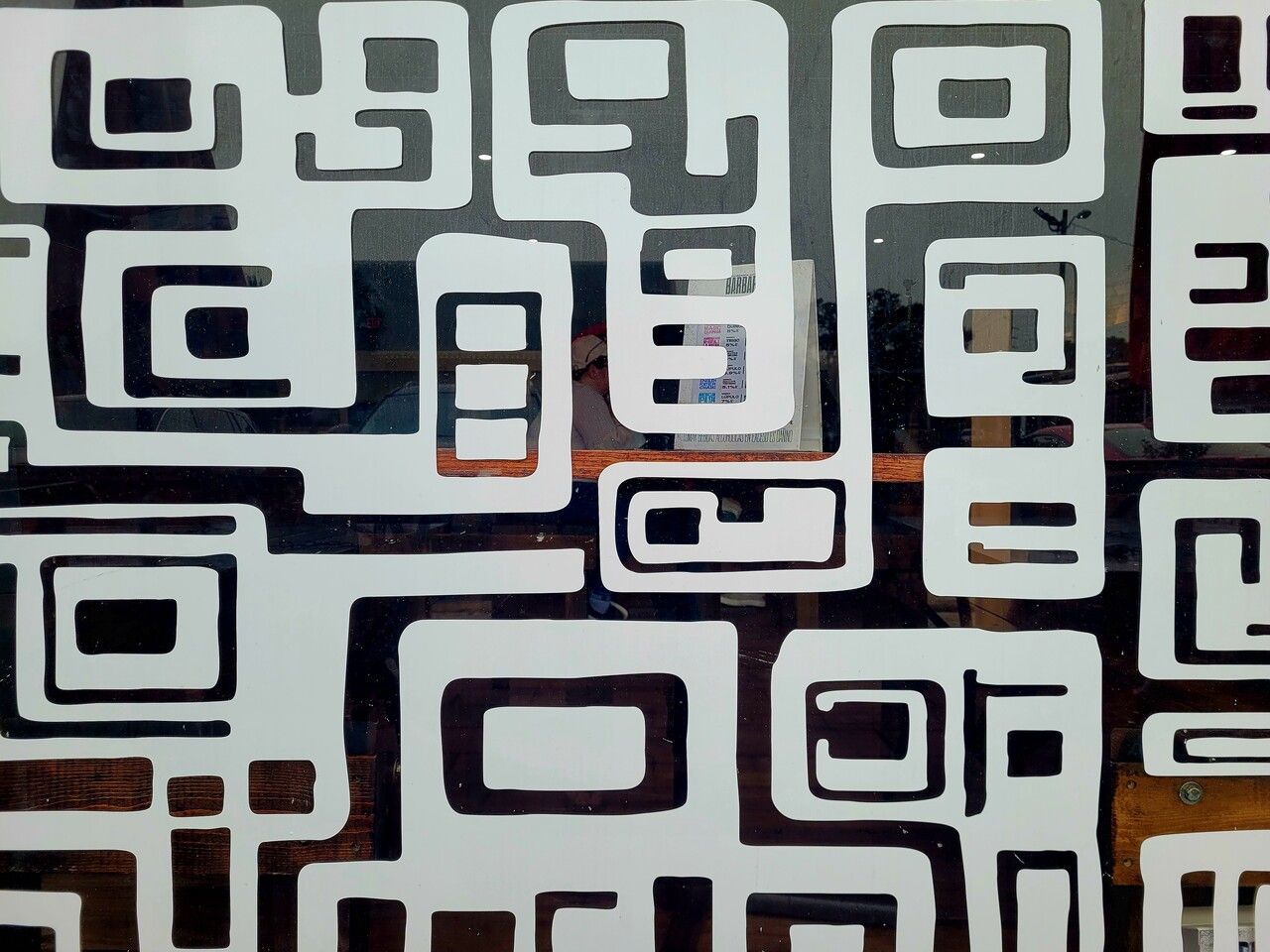 black and white QR codes on a window
