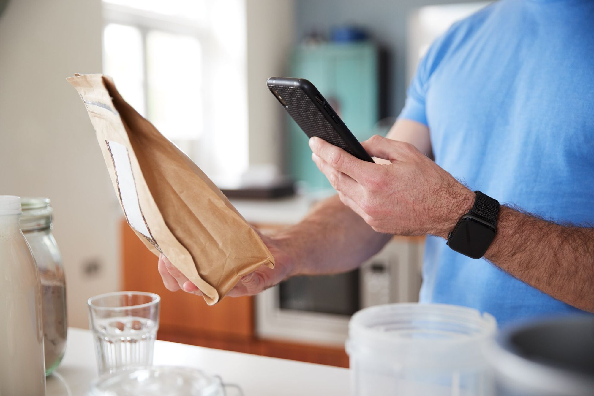 a man scanning a QR code on a package