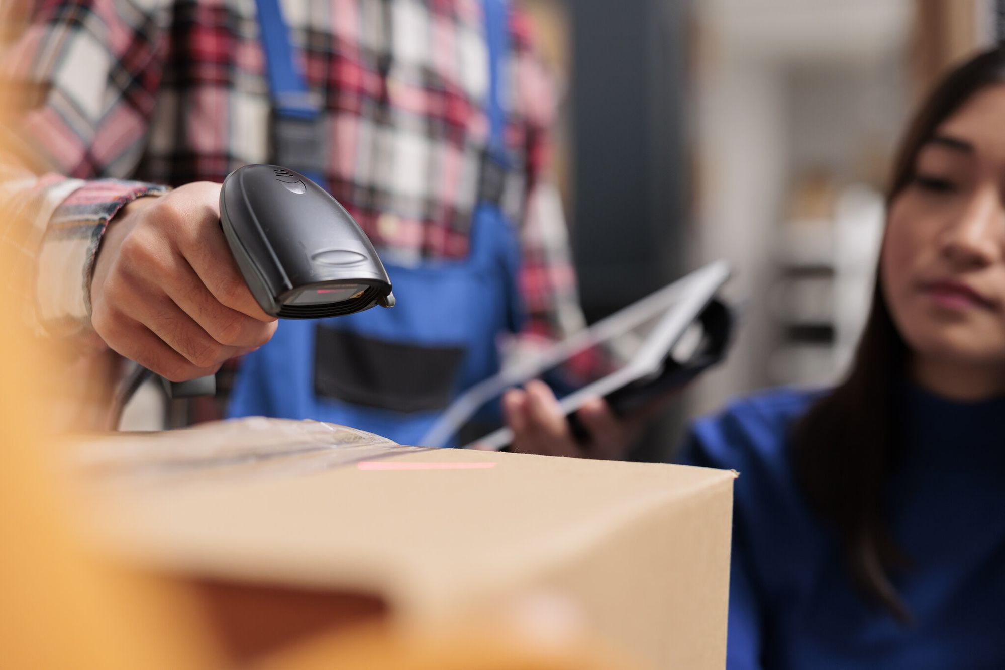 an employee scanning a QR code for inventory management