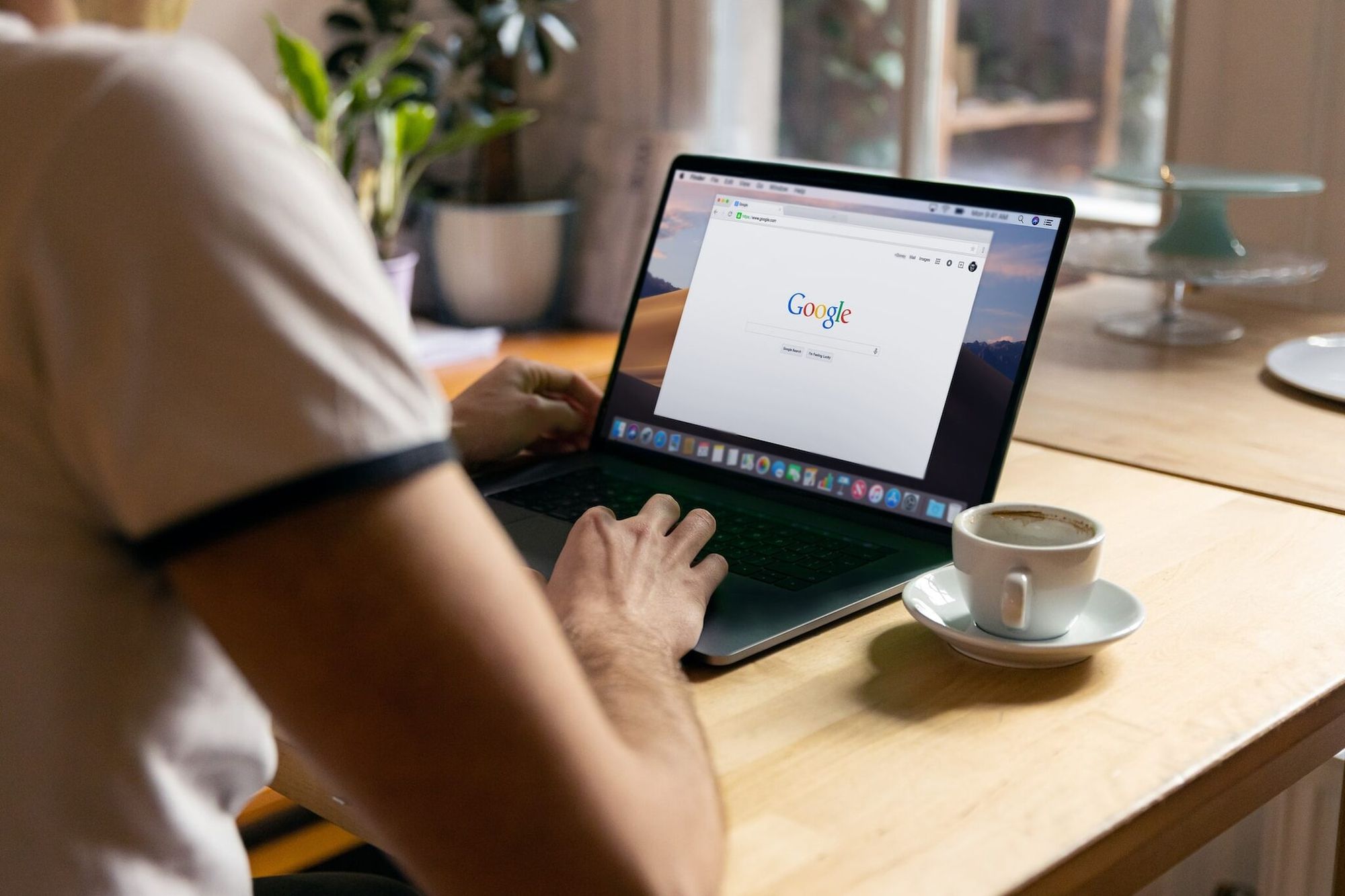 a person using a computer and checking Google