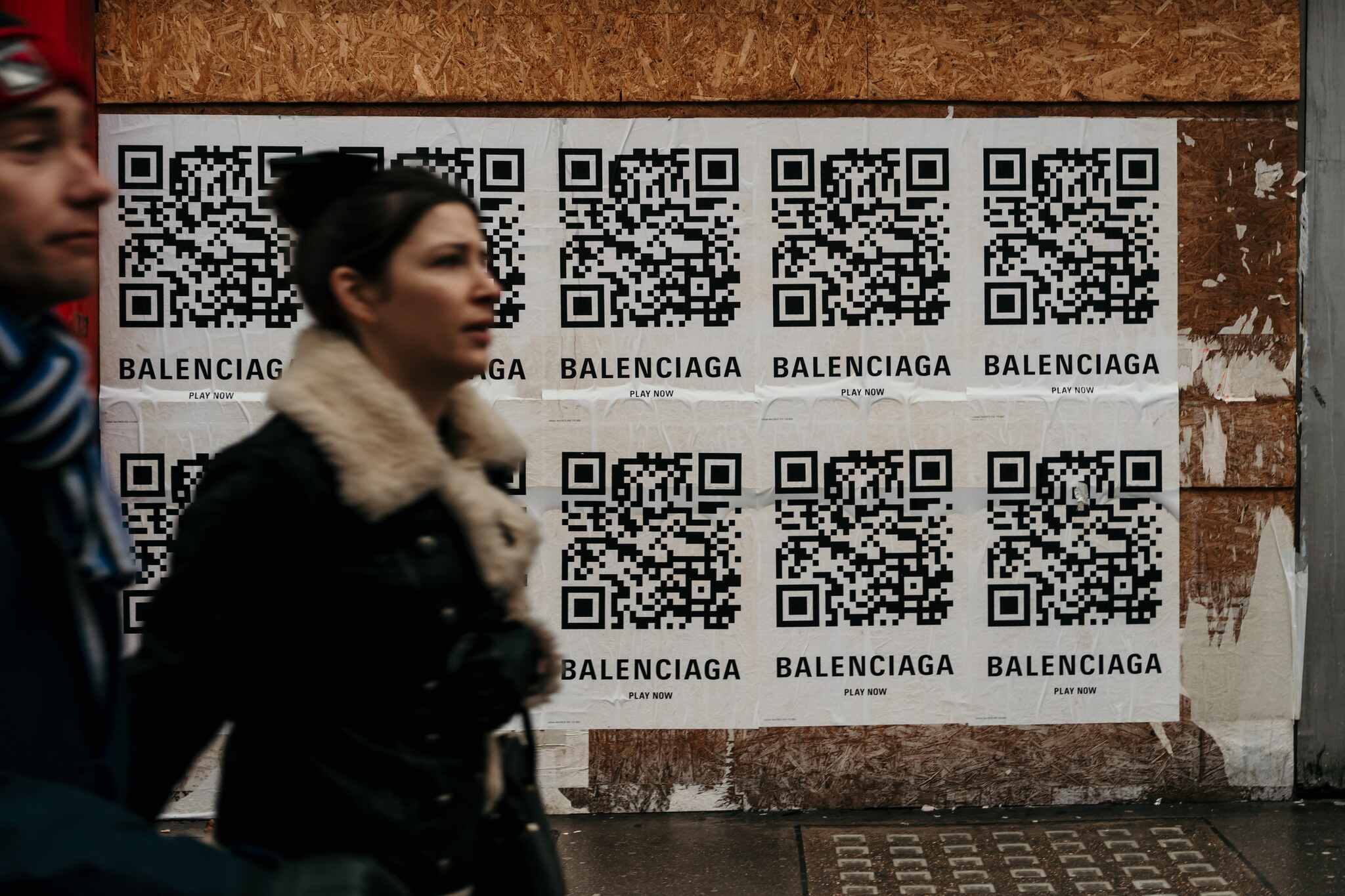 QR code of Balenciaga and two people walking