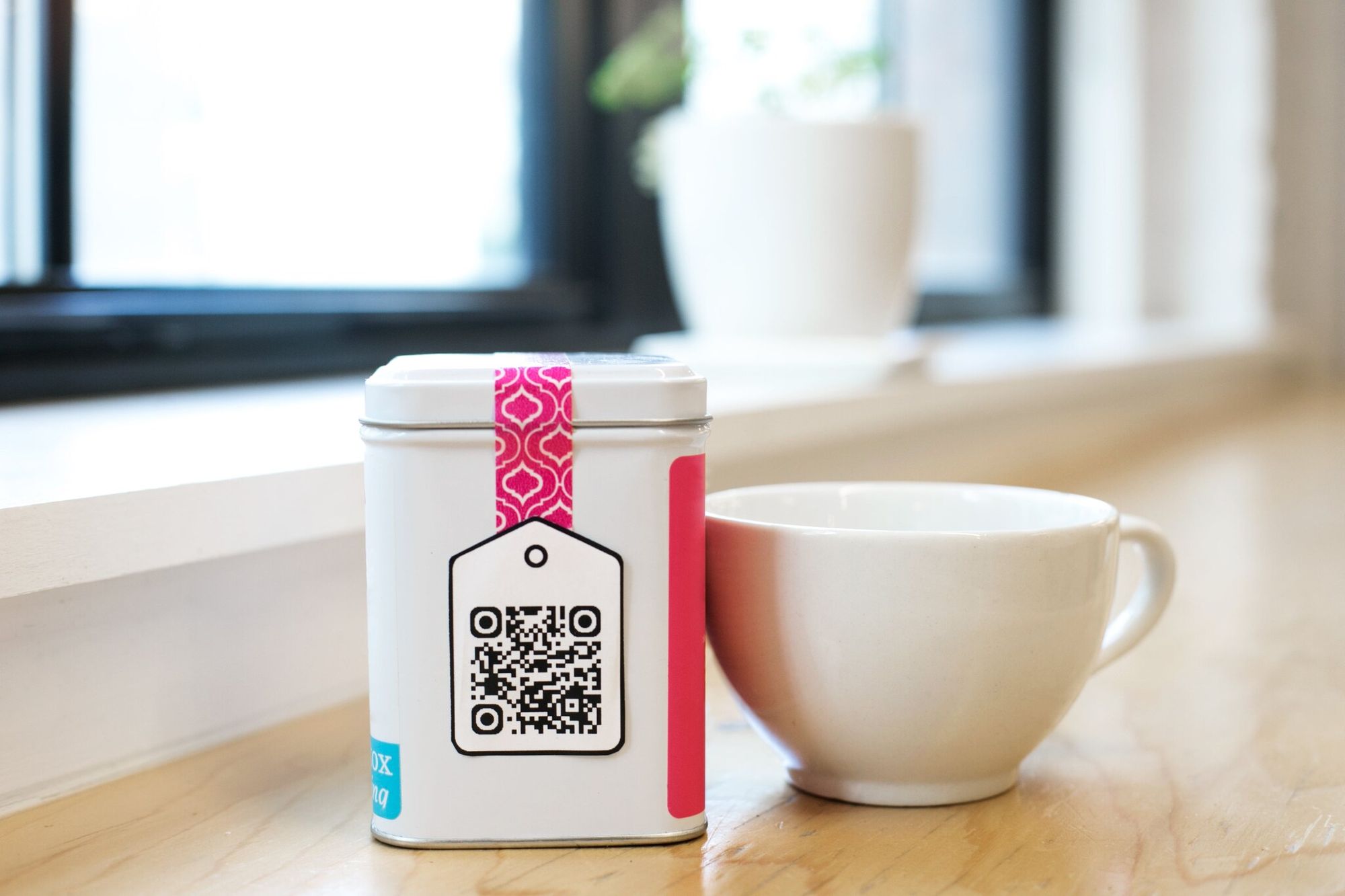 QR code on tea and mug next to it