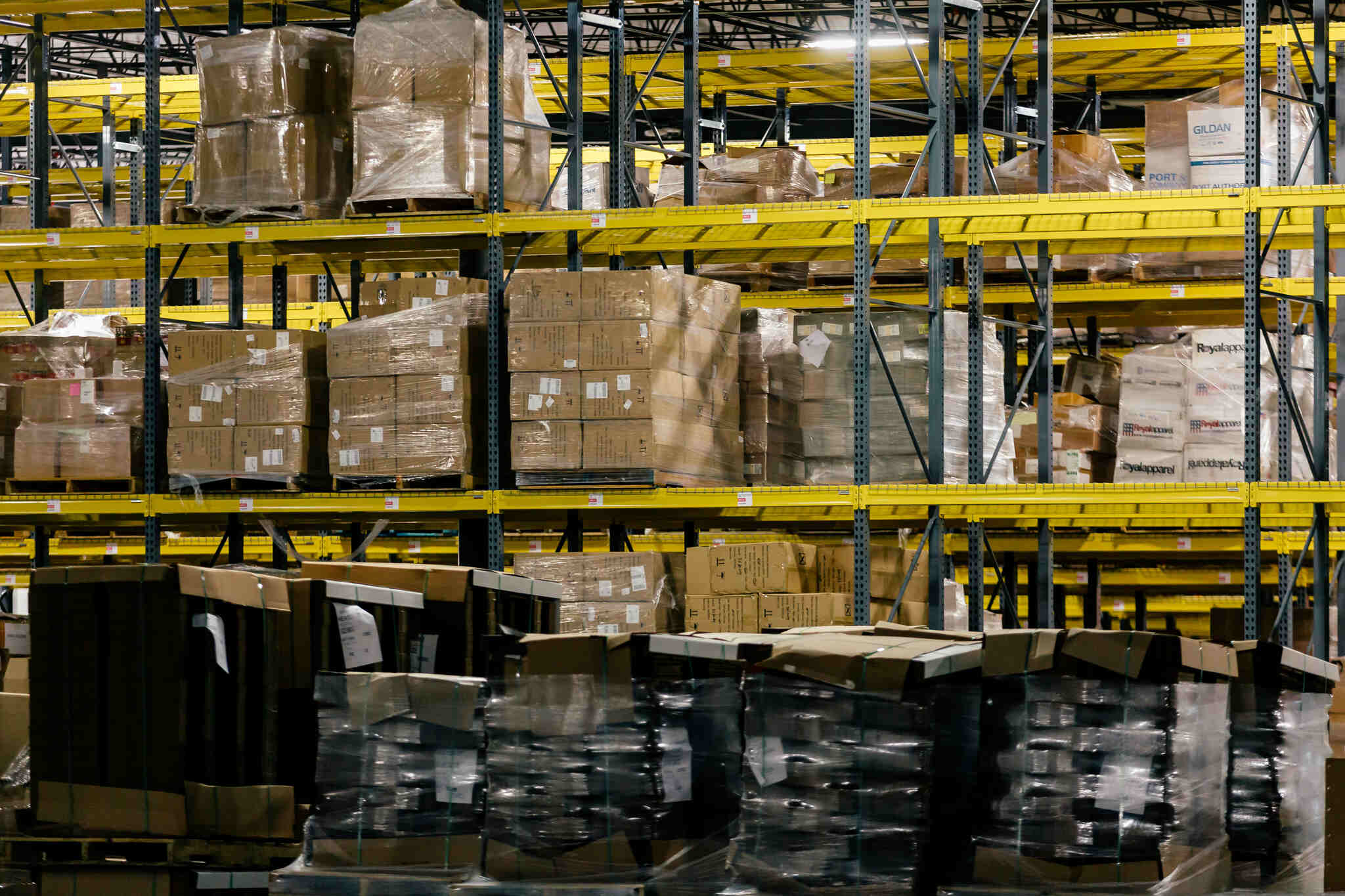 warehouse shelves stocked with product packages