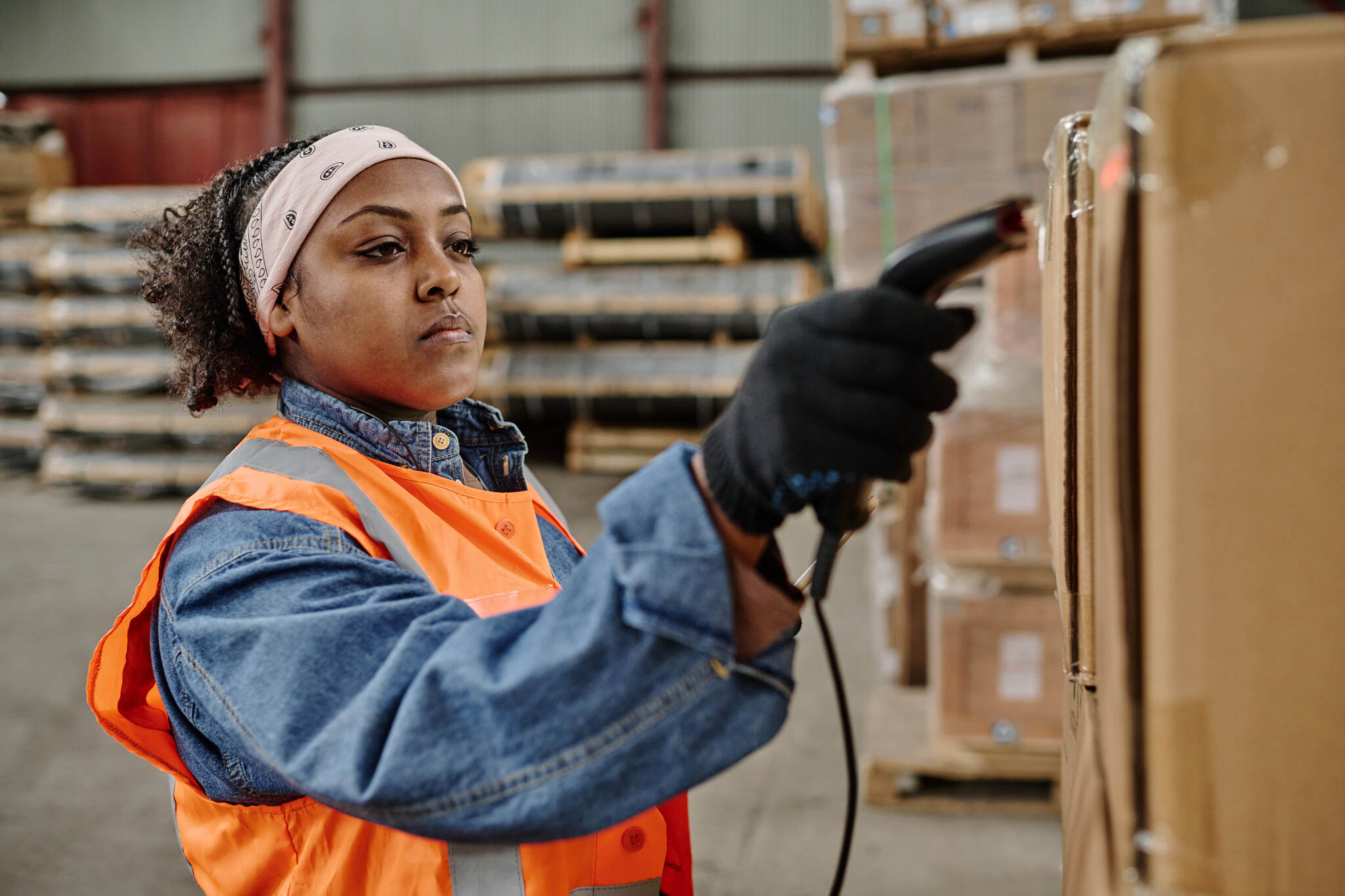 a worker scanning a QR code in a warehouse