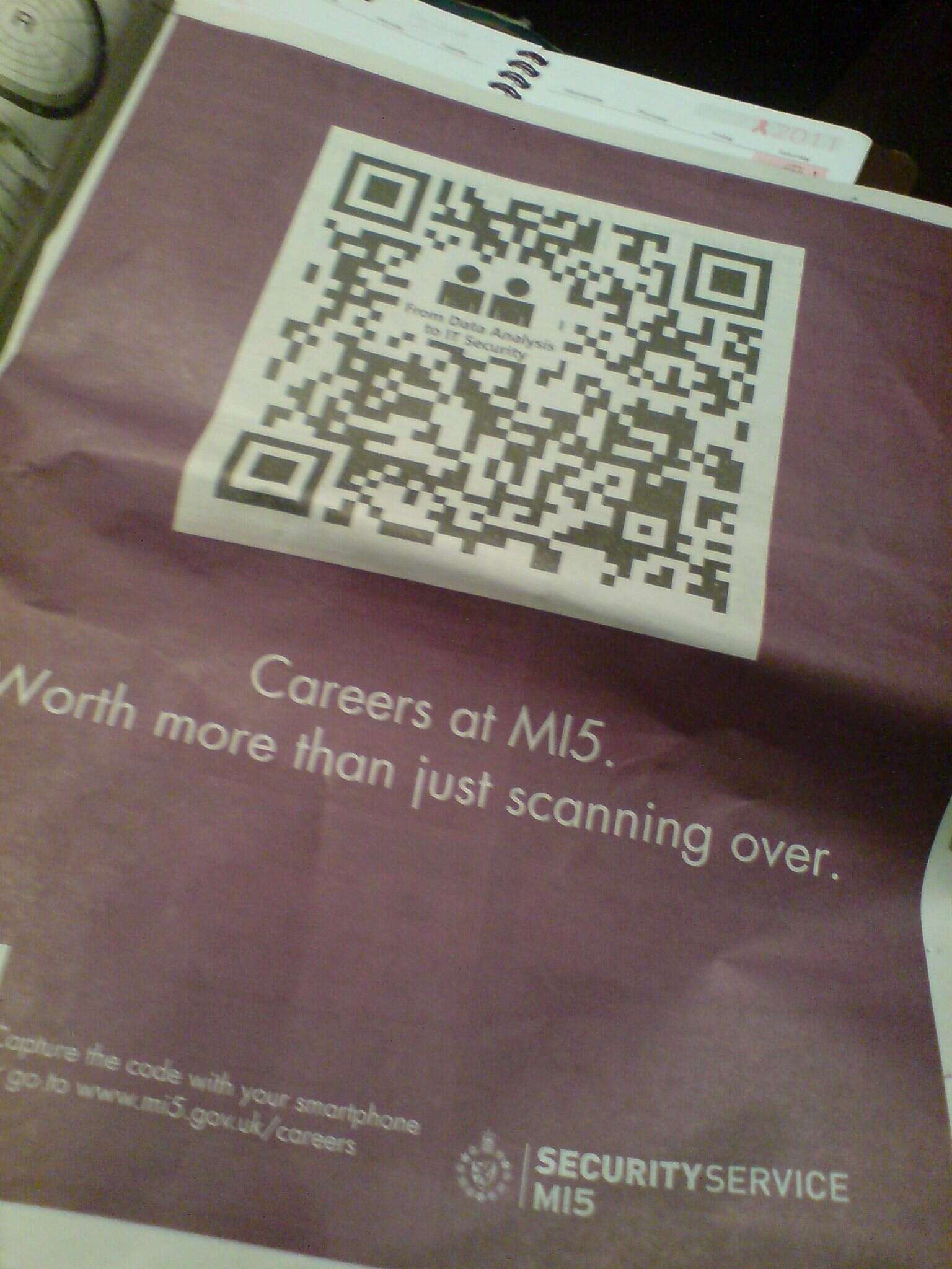 a newspaper ad of recruiting process with QR code
